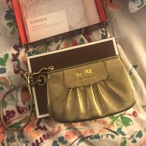 Gold coach wristlet